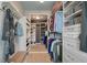 Organized walk-in closet featuring custom shelves, drawers, and ample storage space at 7753 Kinston St, North Charleston, SC 29418