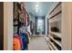A spacious walk-in closet with custom shelving, hanging rods, and natural light at 7753 Kinston St, North Charleston, SC 29418