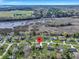 Bird's eye view of neighborhood with solar panels, marshlands, and pinpoint location at 828 Longbranch Dr, Charleston, SC 29414