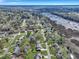 Expansive aerial view of charming neighborhood homes and waterfront marshland on a sunny day at 828 Longbranch Dr, Charleston, SC 29414