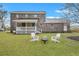 Large backyard features a patio, firepit, and plenty of green space at 828 Longbranch Dr, Charleston, SC 29414