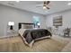 Bright bedroom featuring neutral tones, a ceiling fan, and a cozy rug at 828 Longbranch Dr, Charleston, SC 29414