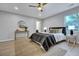 Bright bedroom with neutral colors, stylish decor, and a comfortable bed at 828 Longbranch Dr, Charleston, SC 29414