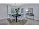 Cozy dining area with modern chandelier, natural lighting and stylish decor at 828 Longbranch Dr, Charleston, SC 29414