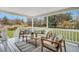 Covered porch features comfortable seating area with natural light at 828 Longbranch Dr, Charleston, SC 29414