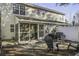 Spacious backyard with a screened porch, patio seating, and well-maintained landscaping at 901 Elm Hall Cir, Summerville, SC 29483