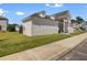 Side view of a well-maintained community clubhouse with a green lawn at 901 Elm Hall Cir, Summerville, SC 29483