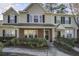Attractive townhome exterior with brick accents, green shrubbery, and manicured front yard at 901 Elm Hall Cir, Summerville, SC 29483