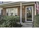Welcoming front door with brick surround and neat landscaping at 901 Elm Hall Cir, Summerville, SC 29483