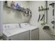 Functional laundry room with modern washer and dryer and convenient shelving at 901 Elm Hall Cir, Summerville, SC 29483