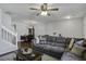 Open-concept living area with hardwood floors and natural light flowing into dining room at 901 Elm Hall Cir, Summerville, SC 29483