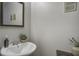 Chic powder room features a pedestal sink and decorative accents at 901 Elm Hall Cir, Summerville, SC 29483