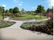 A view of the community's landscaped greenspace and sidewalk at 909 Dusk Dr, Summerville, SC 29486
