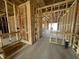 Bathroom under construction featuring wood framing, plumbing, and concrete flooring at 911 Dusk Dr, Summerville, SC 29486