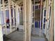 Interior view of new home construction with framing in progress showing plumbing and electrical at 911 Dusk Dr, Summerville, SC 29486