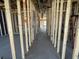 Interior view of new home construction with framing in progress showing open spaces at 911 Dusk Dr, Summerville, SC 29486