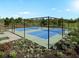 Enjoy a friendly match on these meticulously maintained pickleball courts, surrounded by lush landscaping and community amenities at 911 Dusk Dr, Summerville, SC 29486