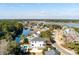 A tranquil aerial view of a neighborhood with waterfront access, lush foliage, and a view of the waterway at , Charleston, SC 29412