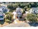Charming aerial view of a two-story home nestled among mature trees, showcasing a well-manicured yard and neighborhood ambiance at , Charleston, SC 29412