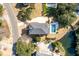 Gorgeous aerial view of the home featuring a pristine pool and a picturesque pond in a landscaped yard at , Charleston, SC 29412