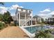 Relaxing backyard showcasing a shimmering pool, verdant grass, and stylish outdoor furnishings for comfortable leisure and entertainment at , Charleston, SC 29412