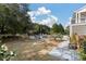 Expansive backyard with an in-ground pool, a patio with comfortable seating and mature trees and landscaping at , Charleston, SC 29412