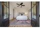 Serene bedroom with french doors, plush rug, and a comfortable bed, creating a peaceful retreat at , Charleston, SC 29412