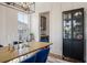 Dining room showcases a black cabinet, bright windows, and stylish light fixture at , Charleston, SC 29412