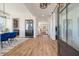 Bright entryway with an open floor plan, light wood floors, and view of the dining and living area at , Charleston, SC 29412