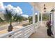 Inviting front porch with classic white railings and a charming view of the neighborhood at , Charleston, SC 29412