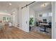 View of a home office, stairs, and living room with luxury vinyl plank flooring at , Charleston, SC 29412