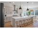 Bright kitchen features an island with seating, stainless appliances, modern pendant lighting, and an eat-in area at , Charleston, SC 29412