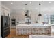Bright kitchen features an island with seating, stainless appliances, and modern pendant lighting at , Charleston, SC 29412