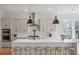 Bright kitchen features an island with seating, stainless appliances, and modern pendant lighting at , Charleston, SC 29412