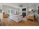 Bright living room featuring a fireplace and tv, with modern furniture and light hardwood floors at , Charleston, SC 29412