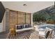 Inviting outdoor living space with comfortable seating, stylish decor, and views of the pool and backyard at , Charleston, SC 29412