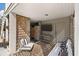 Covered patio with a comfortable seating area, TV, and a convenient outdoor shower at , Charleston, SC 29412