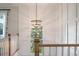 A modern stairway showcasing the wainscotting details and light fixture at , Charleston, SC 29412