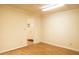 A clean basement area with wood floors and white walls at 105 Pinewood St, Walterboro, SC 29488