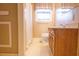Bathroom with a sink, toilet, window, and a shower at 105 Pinewood St, Walterboro, SC 29488