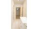 Bright bathroom with white tile, vanity, and view into the bedroom at 105 Pinewood St, Walterboro, SC 29488