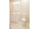 Well-lit bathroom with white tile, vanity, toilet, and modern fixtures at 105 Pinewood St, Walterboro, SC 29488