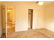 Neutral bedroom featuring a ceiling fan, closet, and views to other rooms at 105 Pinewood St, Walterboro, SC 29488