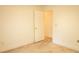 Bedroom with neutral walls, carpet flooring, and access to other rooms at 105 Pinewood St, Walterboro, SC 29488