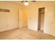 Neutral bedroom featuring a ceiling fan, closet, and access to other rooms at 105 Pinewood St, Walterboro, SC 29488