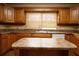 Kitchen featuring an island, laminate countertops and wooden cabinets at 105 Pinewood St, Walterboro, SC 29488