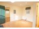 A cozy living room with wood floors, a decorative window and an exterior door at 105 Pinewood St, Walterboro, SC 29488