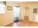 A bright room with white walls, wood floors, and two doorways at 105 Pinewood St, Walterboro, SC 29488