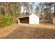 Exterior view of a shed with covered area and backyard at 105 Pinewood St, Walterboro, SC 29488