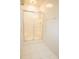Clean white-tiled shower featuring sliding glass doors and modern fixtures at 105 Pinewood St, Walterboro, SC 29488